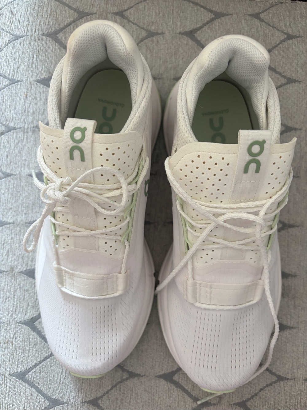 On Running White Sneakers with Light Green Accents